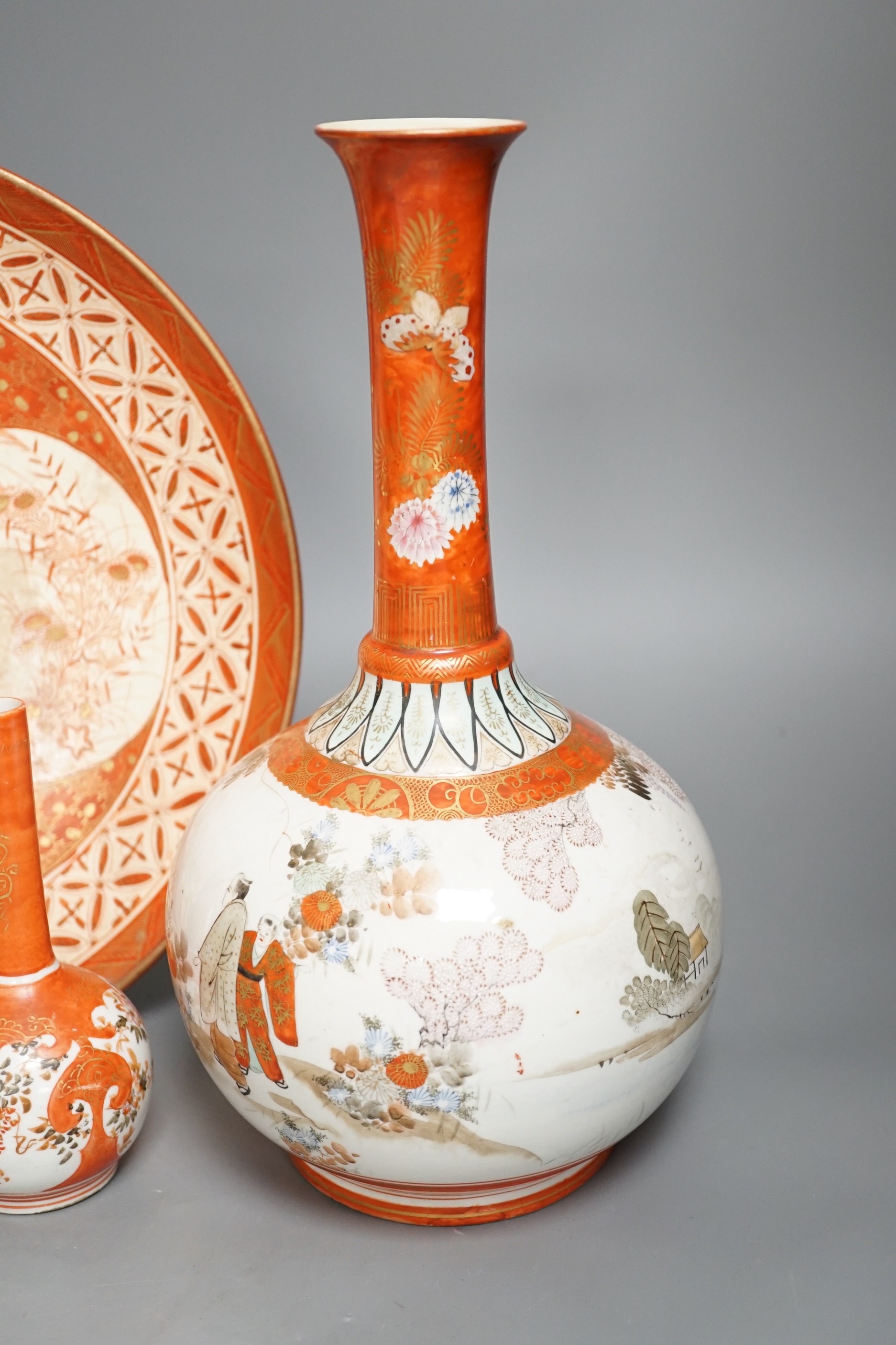 A 19th century Kutani bottle vase, a pair of smaller, similar vases and a large dish (4). Bottle vase 31cms high.